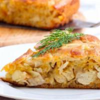 Chicken Pie · Freshly baked chicken pie with shredded chicken, diced tomatoes, onions, cheese and parsley.
