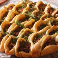 Ground Beef Pie (Lahmacun) · Fresh ground beef pie with diced tomatoes, onions, paprika and house spices.