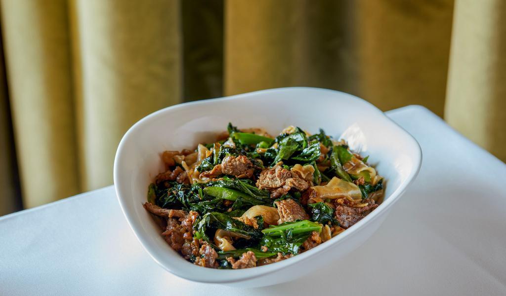 Wok Beef Noodles · Wok-flashed rice noodles tossed with Chinese broccoli, flank steak, eggs, & oyster sauce.