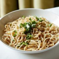 Garlic Noodles · Egg noodles wok-fired with garlic, butter, parmesan cheese, & fresh cilantro.