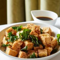Basil Tofu · Vegetarian.  Crisp tofu wok-tossed with garlic & basil in a seasoned soy sauce; finished wit...