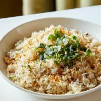 Garlic Fried Rice · Gluten-free. Long-grain jasmine rice wok-fired with butter & garlic, topped with cilantro.  ...