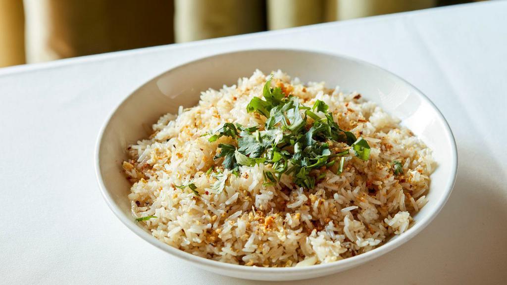 Garlic Fried Rice · Gluten-free. Long-grain jasmine rice wok-fired with butter & garlic, topped with cilantro.  (serves 2)