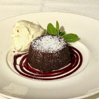 Molten Chocolate Lava Cake · Chocolate lava cake, powdered sugar, raspberry coulis, vanilla ice cream (packed in ice).
