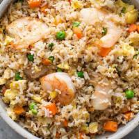 Indo-Chinese Prawn Fried Rice · Long grain rice tossed with fresh prawns, vegetables and Indo-Chinese sauces, finished with ...