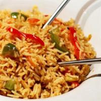 Vegetable Singapore Fried Rice · Spicy Indo-Chinese fried rice, with carrots, beans, peas, and bell peppers, flavored with Or...