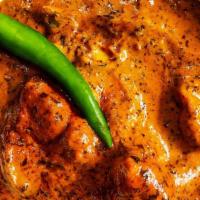 Chicken Masala · Chicken cubes, simmered with onions, tomatoes, yogurt, and a house blend of aromatic spices.