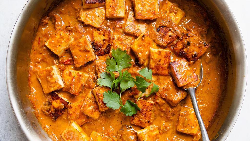Paneer Tikka Masala · Tandoori paneer cubes cooked in a medium spiced onion and tomato sauce, along with bell peppers and a house blend of spices.