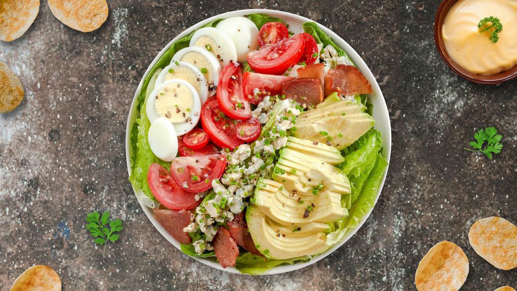 Call A Cobb Salad  · (Vegetarian) Romaine hearts, blue cheese, bacon, hard-boiled pastured egg, avocado, and tomato tossed with vinaigrette dressing.