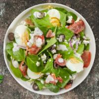 Popeye's Muncher Salad  · Spinach, feta, bacon, onion, olives, and two hard-boiled eggs tossed with house dressing.