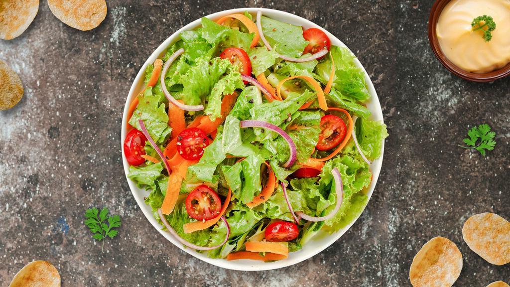 Classic House Salad  · (Vegetarian) Romaine lettuce, cherry tomatoes, carrots, and onions dressed tossed with lemon juice & olive oil