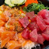 Spring Bowl · Fresh salmon, Ahi Tuna, seaweed salad, cucumber, fried shallot, jalapeno, edamame, unagi sau...