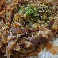 Gyu don · slow cooked beef sukiyaki with onion. served with rice