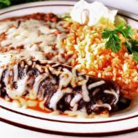 Mole Enchilada · A corn tortilla filled with chicken or cheese in a spicy and  sweet mole sauce, rice, beans ...