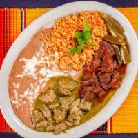 Chile Colorado with Rice, Beans & Tortillas · Tender beef chunks in a spicy tomato sauce and served with rice, beans, and tortilla
