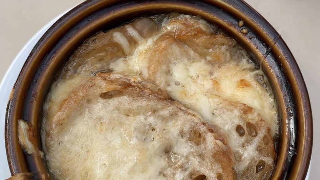 Onion Soup · Traditional onion soup with cheese & toasted bread