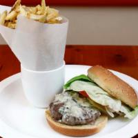 Chouquet’s Burger · With pommes frites, butter lettuce, organic tomato, pickle, onions, and harissa aïoli.