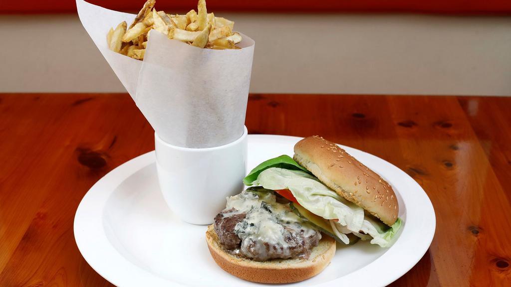 Chouquet’s Burger · With pommes frites, butter lettuce, organic tomato, pickle, onions, and harissa aïoli.