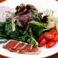 Salade Nicoise · Organic mixed green with Ahi tuna, olives, potatoes, green beans, tomatoes and hard boiled e...
