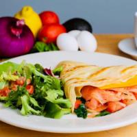 Fresh Lox Crepes · Lox, capers, onion, tomato, spinach, and cheddar cheese.