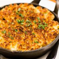 Mac & Cheese · Aged white cheddar, fontina, Parmesan, buttery bread crumbs.