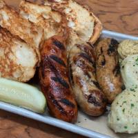 Sausage Plate for two · House cheddar beer brat, spicy pork sausage and Sonoma lamb sausage, potato dumplings, spicy...