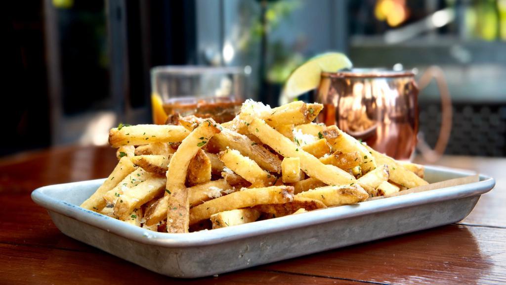 Truffle Fries · House cut Kennebec fries with truffle, parmesan and parsley, served with lemon garlic aioli