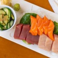 Combo Sashimi (12) · Sliced raw salmon tuna and hamachi.