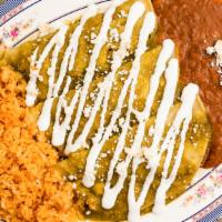 Enchiladas Verdes · Three corn tortillas stuffed with shredded chicken. Served with rice and beans. Topped with ...