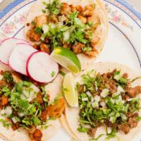 Tacos · Served with salsa, onions, and cilantro.