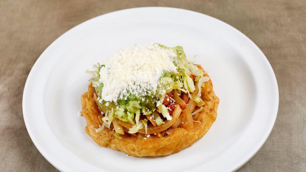 Sopes · Thick tortilla with pinched sides.  Served with your choice of beef, chicken or al pastor, beans, lettuce, sour cream & salsa.