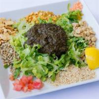 Tea Leaf Salad · This salad is a popular traditional treat unique to Burma. A mix of Burmese tea leaves, frie...