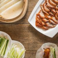  Peking Duck( Tea-Smoked) 樟茶片皮鴨 · Served with roasted duck, pancakes, green onion, cucumber, and paste.