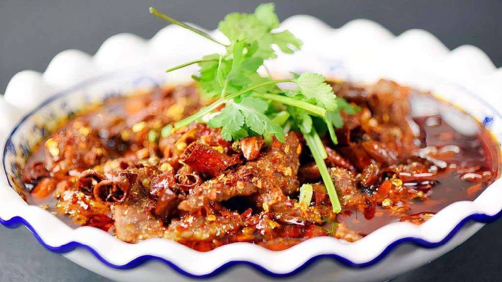 Beef with Flaming Chili Oil 水煮牛肉 · Spicy. Boiled sliced of the finest Lamb or Beef in our Chef's special red hot chili oil.