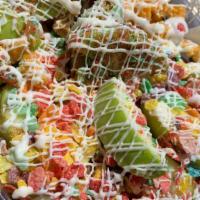 Apple Nachos · Fresh apples slices covered in our homemade caramel and white chocolate drizzle. Then topped...