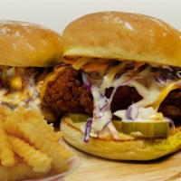 Nash Combo #2 · Two hot chicken sliders with comeback sauce, nashville numb, creamy slaw, pickles and side f...