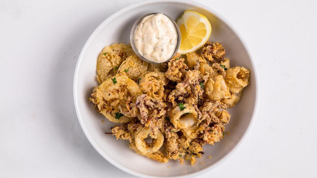 Golden Fried Calamari · Golden-fried calamari and lemon wheels served with the house-made tartar sauce.. CANNOT BE MADE GLUTEN FREE.