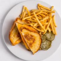 Grilled Cheese Sandwich · American and cheddar cheese on buttered and grilled sourdough toast. Served with kid's side....