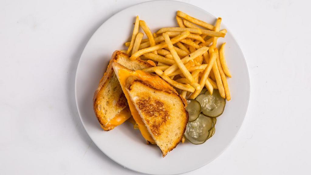 Grilled Cheese Sandwich · American and cheddar cheese on buttered and grilled sourdough toast. Served with kid's side. CANNOT BE DAIRY FREE.