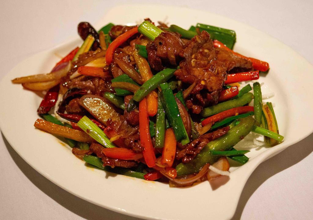 Mongolian Beef · Spicy. Shredded green and red peppers, bamboo shoots, onion, sizzling with Mongolian sauce.