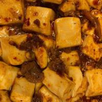 4. Mapo Tofu · Rice served with fried fish with chili pepper.
