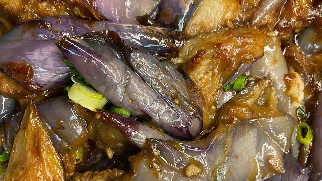 9. Spicy Eggplants · Rice served with fried fish with chili pepper.