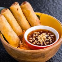Vegetarian Crispy Egg Rolls · Four (4) pieces. Vegetarian egg rolls stuffed with silver noodles, onions, and carrots. Serv...