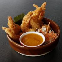 Crispy Tiger Prawns · Eight (8) pieces. Fried tiger prawns coated in panko bread. Served with spicy mango sauce