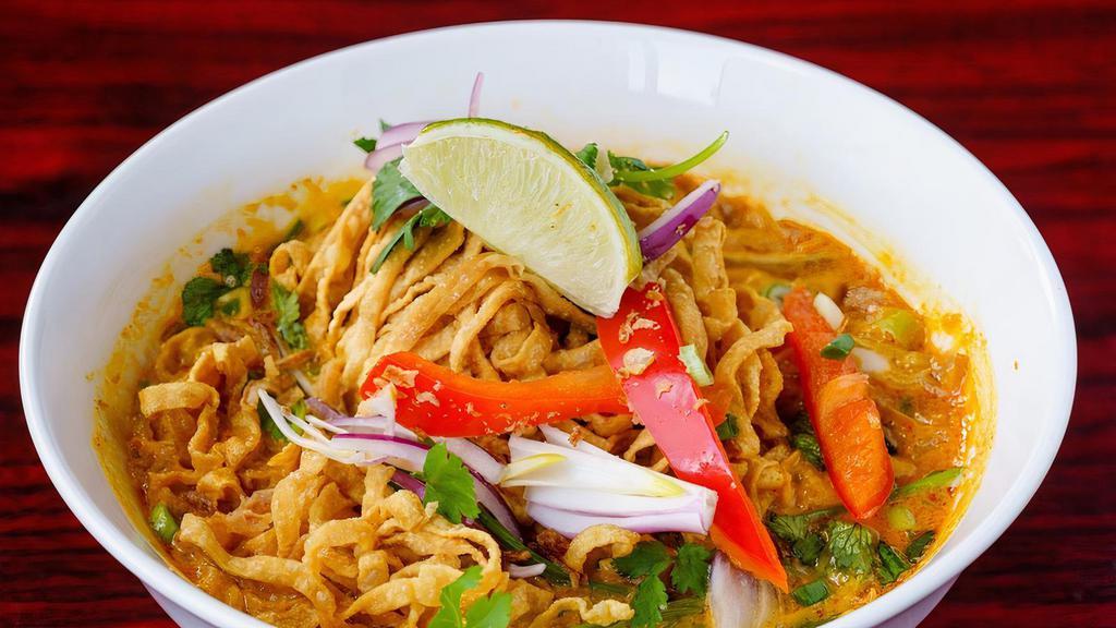 Vegetarian Chiang Mai · Mildly spiced. Crispy egg noodle in yellow curry soup, tofu, vegetables, and pickled mustard green.