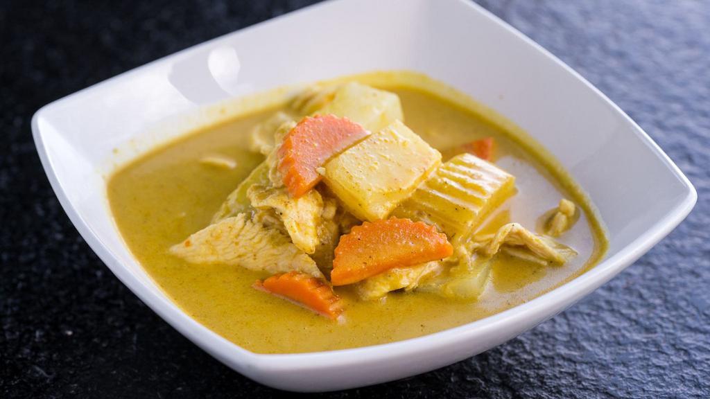 Yellow Curry  (Gluten-Free) · Coconut yellow curry with potatoes and carrot. Served with jasmine rice and choice of tofu, chicken, or tiger prawns.