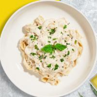 Like in Rome Pasta · Fettuccine with garlic, cream, roast chicken, and sun-dried tomato. Milk it dry and then lig...