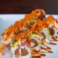 The Roll · Raw. Spicy tuna, shrimp tempura and cucumber, topped with tuna, salmon, and hamachi, tempura...