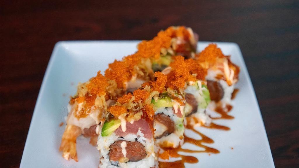 The Roll · Raw. Spicy tuna, shrimp tempura and cucumber, topped with tuna, salmon, and hamachi, tempura crunch,  Unagi sauce and spicy Mayo.