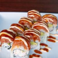 Rose Roll · Raw. Crab and avo. Topped with spicy tuna. 
Unagi sauce and spicy mayo